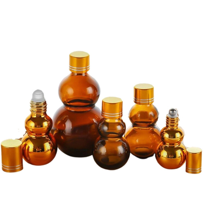 Flacons roll-on d'huile parfumée en verre ambré personnalisables de qualité supérieure 10 ml/50 ml/100 ml avec finition miroir dorée, doubles bouchons dorés et base épaissie